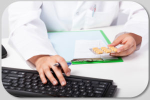 Horizontal view of pharmacist's hands realizing prescription